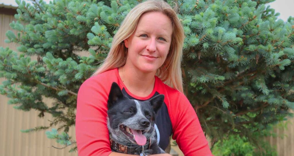 Buckaroos daycare team member giving a dog individual attention