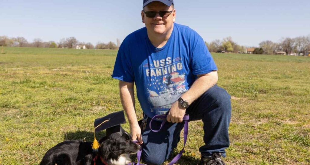 Dog and handler celebrating therapy dog training graduation in Pauls Valley, OK